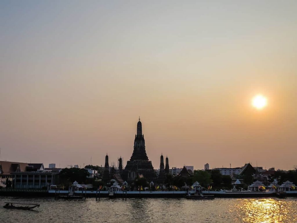 The best place to watch sunset in Bangkok is opposite Wat Arun!